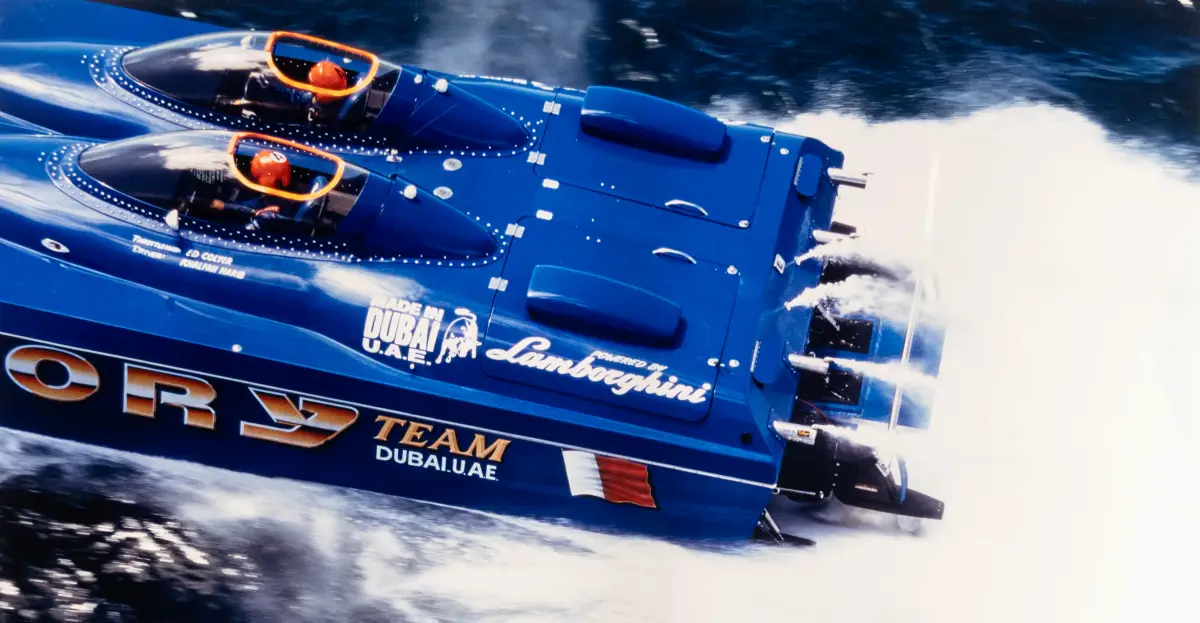 Victory Team's blue Lamborghini-powered offshore catamaran at speed in Made in Dubai livery